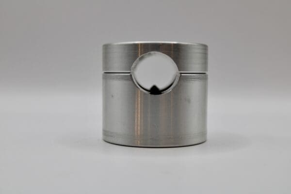 A metal cylinder with a hole in it.